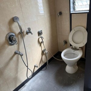 Bathroom in 3 BHK Apartment at Omkar Vayu, New Dinkar Housing Cooperative Society – for Rent