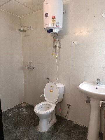 Bathroom in 2.5 BHK Apartment at Samridhi Daksh Avenue, Sector 150 – for Rent