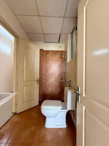 Bathroom in 3 BHK Apartment at Sushma Elite Cross, Dhakoli – for Rent