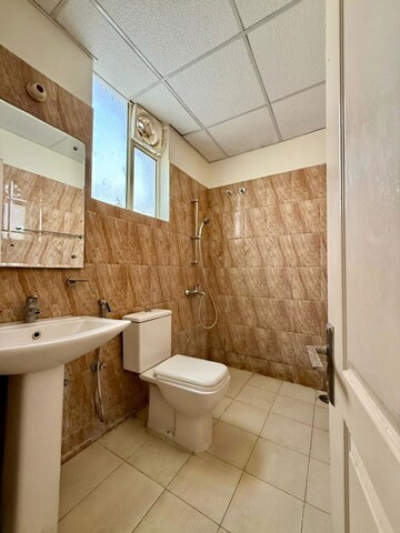 Bathroom in 3 BHK Apartment at Sushma Elite Cross, Dhakoli – for Rent