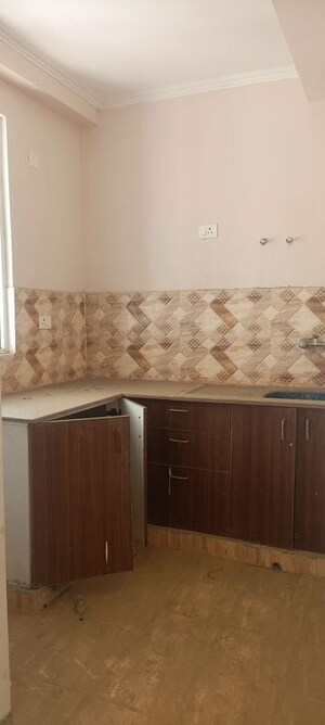 Kitchen in 2 BHK Apartment at Amrapali Golf Homes, Sector 4 Greater Noida – for Sale