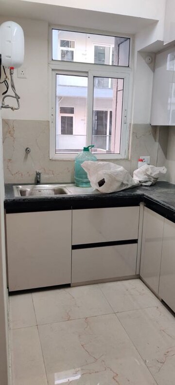 Kitchen in 2.5 BHK Apartment at Smart World Gems, Sector 89 – for Rent