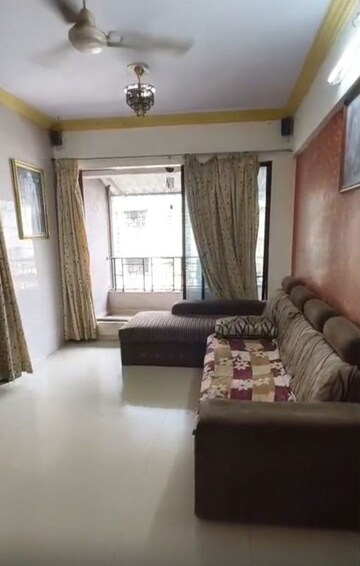 Living Room in 1 BHK Apartment at Rajaram Complex CHS, Dombivli West – for Sale