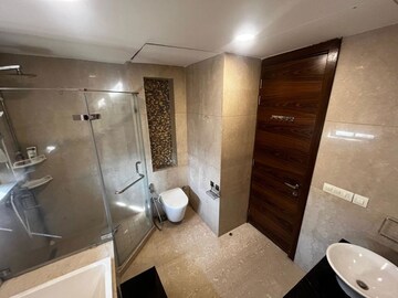 Bathroom in 4 BHK Apartment at Tata Raheja Raisina Residency, Sector 59 – for Sale