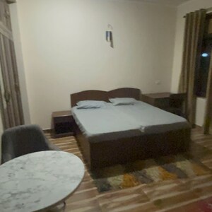 Bedroom in 6+ BHK Builder Floor at RWA Apartments Sector 52, Arun Vihar – for Rent