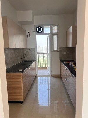 Kitchen in 3 BHK Apartment at Samridhi Luxuriya Avenue, Sector 150 – for Rent