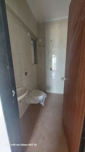 Bathroom in 2 BHK Apartment at Lalani Residency, Kavesar – for Sale