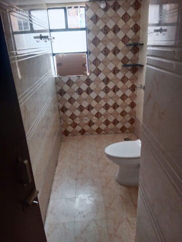Bathroom in 2 BHK Apartment at Proview Officer City 2, Raj Nagar Extension – for Rent