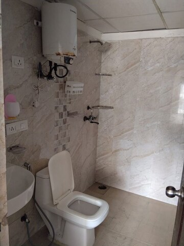 Bathroom in 2.5 BHK Apartment at Aims Golf City, Sector 75 – for Rent