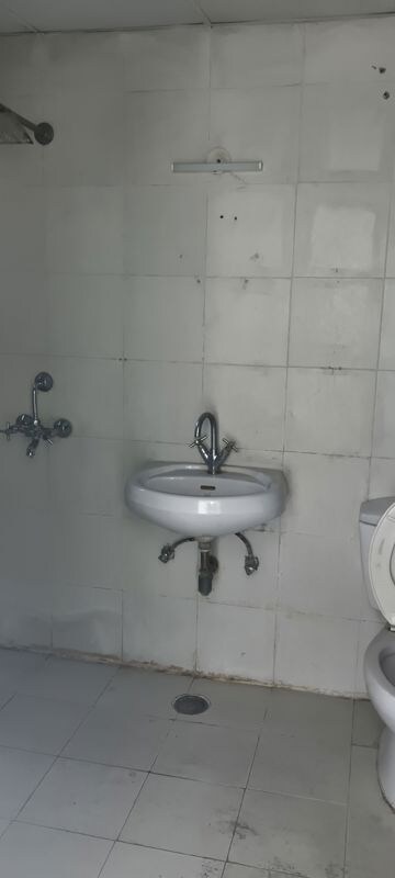Bathroom in 4 BHK Apartment at Ajnara Grace, Raj Nagar Extension – for Rent