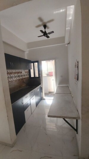 Kitchen in 2 BHK Apartment at Saffron Binory Residency, Satellite – for Rent