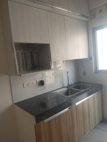 Kitchen in 2 BHK Apartment at Gulshan Bellina, Sector 16 Greater Noida – for Rent