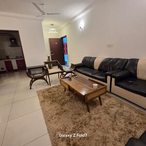 Living Room in 2 BHK Apartment at Puravankara Palm Beach, Essel Gardens – for Rent