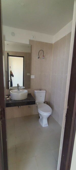 Bathroom in 3.5 BHK Builder Floor at Emaar Palm Gardens, Sector 83 – for Sale
