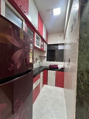 Kitchen in 1 BHK Apartment at Yashraj Park CHS, Kasarvadavali – for Sale