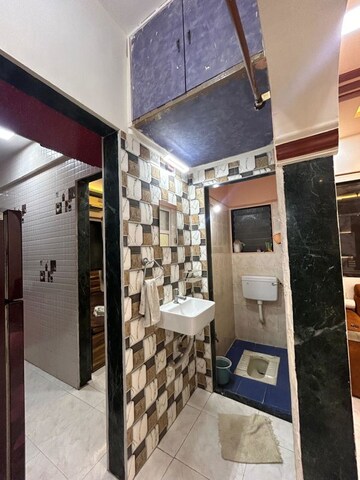 Kitchen in 1 BHK Apartment at Yashraj Park CHS, Kasarvadavali – for Sale