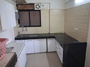 Kitchen in 2 BHK Apartment at Aarti Heights, Mohammadwadi – for Rent