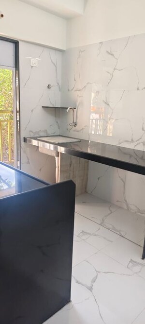 Kitchen in 2 BHK Apartment at Hava Hira CHS, Malad West – for Sale