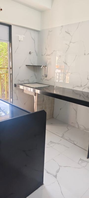 Kitchen in 2 BHK Apartment at Hava Hira CHS, Malad West – for Sale