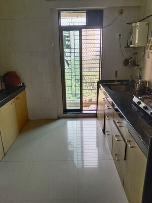 Kitchen in 2 BHK Apartment at Shree Satya Shankar Residency, Manpada – for Rent