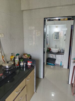 Kitchen in 2 BHK Apartment at Shree Satya Shankar Residency, Manpada – for Rent