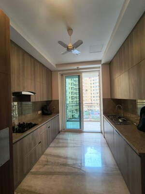 Kitchen in 2 BHK Apartment at Ambience Creacions, Sector 22 – for Rent
