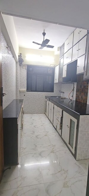 Kitchen in 2 BHK Apartment at Aries Leo Sagittarius CHS, Malad West – for Sale