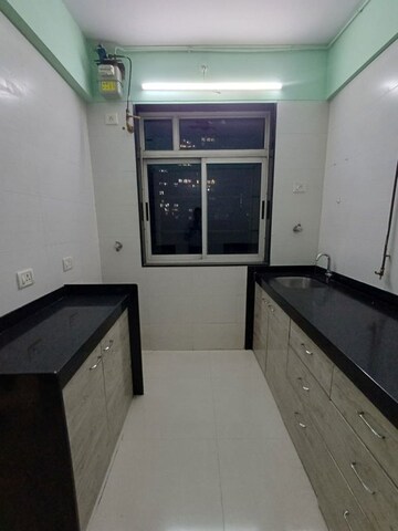 Kitchen in 2 BHK Apartment at Vasant Fiona, Pokhran Road No Two – for Rent
