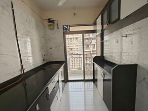 Kitchen in 1 BHK Apartment at Om Prabhu Manohar CHS, Seawoods Sector 50 – for Sale