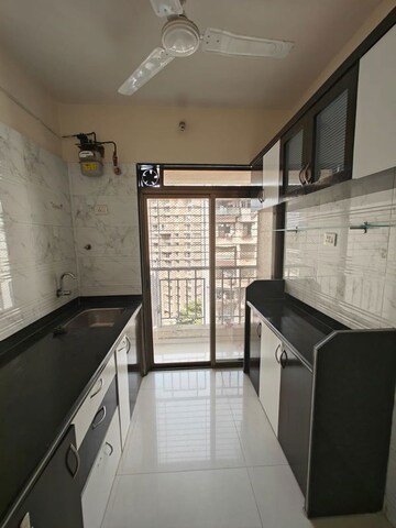 Kitchen in 1 BHK Apartment at Om Prabhu Manohar CHS, Seawoods Sector 50 – for Sale