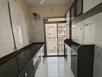 Kitchen in 2 BHK Apartment at Om Prabhu Manohar CHS, Seawoods Sector 50 – for Rent