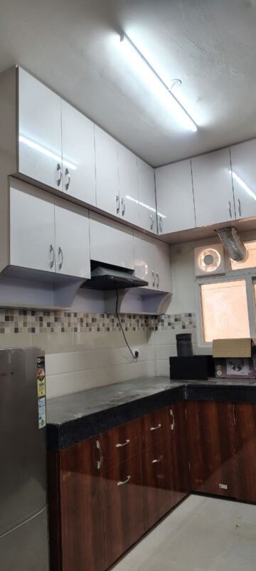 Kitchen in 1.5 BHK Apartment at Signature Orchard Avenue 2, Sector 93 – for Rent
