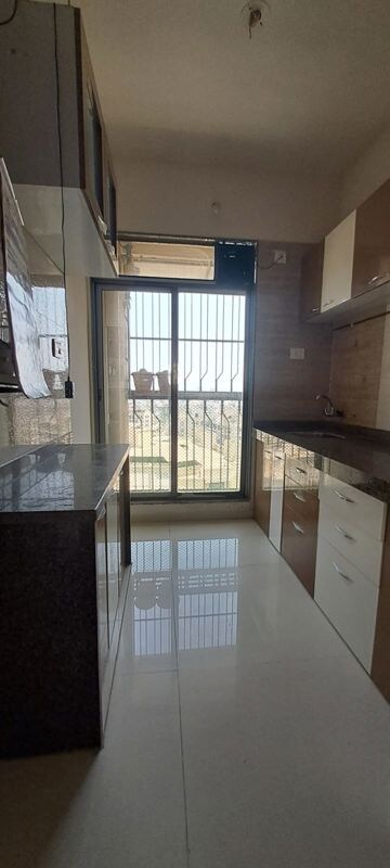 Kitchen in 1 BHK Apartment at Trident Woods, Katrap – for Rent