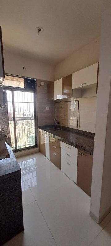 Kitchen in 1 BHK Apartment at Trident Woods, Katrap – for Rent