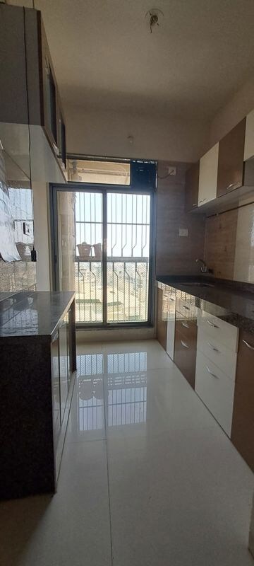 Kitchen in 1 BHK Apartment at Trident Woods, Katrap – for Rent
