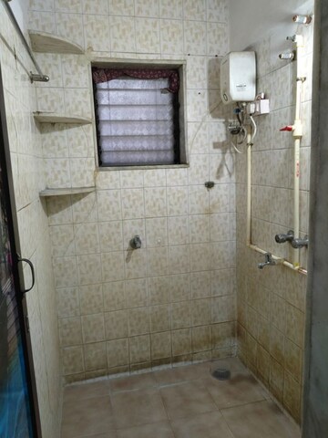 Bathroom in 1 BHK Apartment at Brightland Phase 1 CHS, Balkum Pada – for Rent