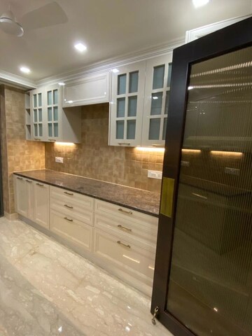 Kitchen in 4 BHK Apartment at Panchsheel Park – for Sale