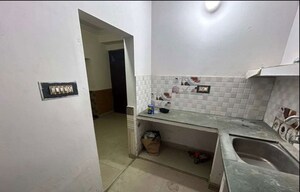 Kitchen in 2 BHK Apartment at Husainganj – for Rent