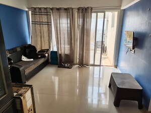 Living Room in 2 BHK Apartment at Mantra Insignia, Mundhwa – for Rent