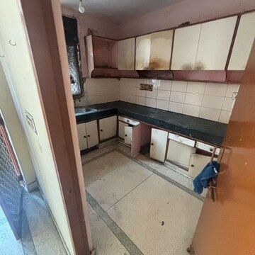 Kitchen in 2.5 BHK Apartment at Alok Vihar, Sector 50 – for Sale