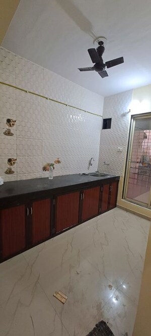 Kitchen in 2 BHK Apartment at Pranjee Garden City, Katrap – for Rent