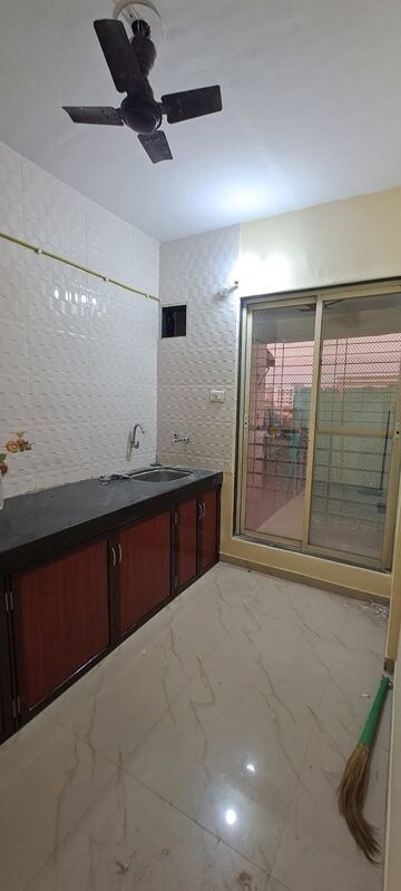 Kitchen in 2 BHK Apartment at Pranjee Garden City, Katrap – for Rent