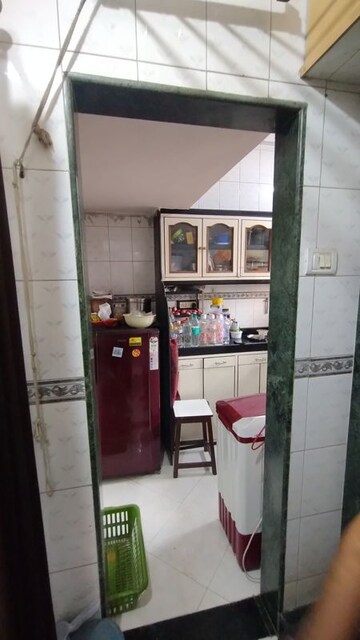 Kitchen in 1 BHK Apartment at Seawoods Sector 48 – for Sale