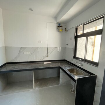 Kitchen in 2 BHK Apartment at Dev Leo Tower, Adarsh Nagar – for Rent