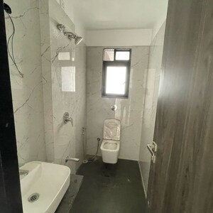 Bathroom in 2 BHK Apartment at Dev Leo Tower, Adarsh Nagar – for Rent
