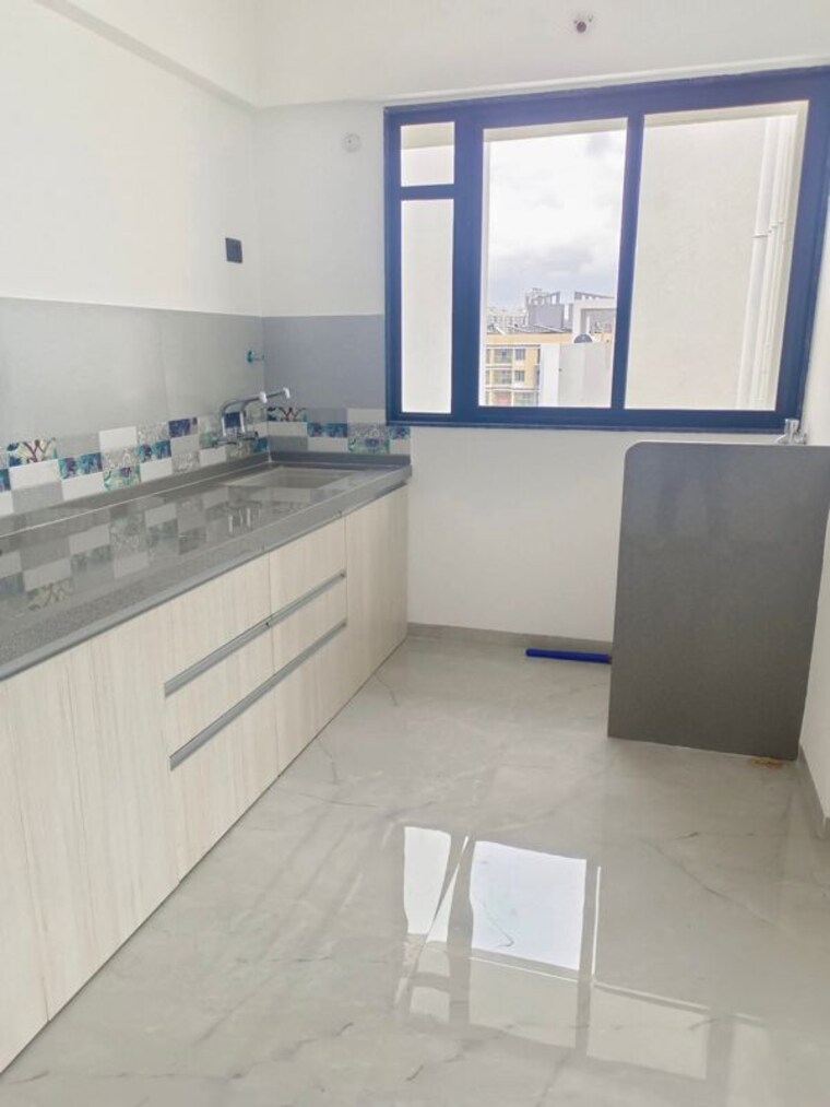 Kitchen, unique-youtopia 2 Bedroom 765 Sq.Ft. Apartment In Kharadi Pune 10056473