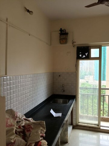 Kitchen in 2 BHK Apartment at Neelkanth Greens, Manpada – for Rent