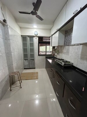 Kitchen in 2 BHK Apartment at Cosmos Lounge, Manpada – for Rent