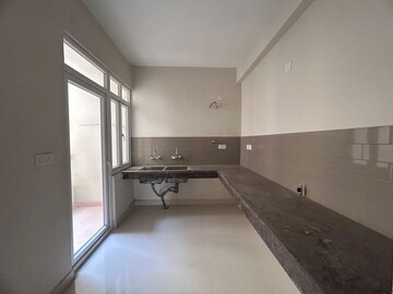 Kitchen in 2 BHK Apartment at Ajnara Le Garden, Sector 16b Greater Noida – for Rent