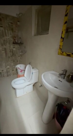 Bathroom in 3 BHK Apartment at Urban Axis Urban Woods, Sushant Golf City – for Rent